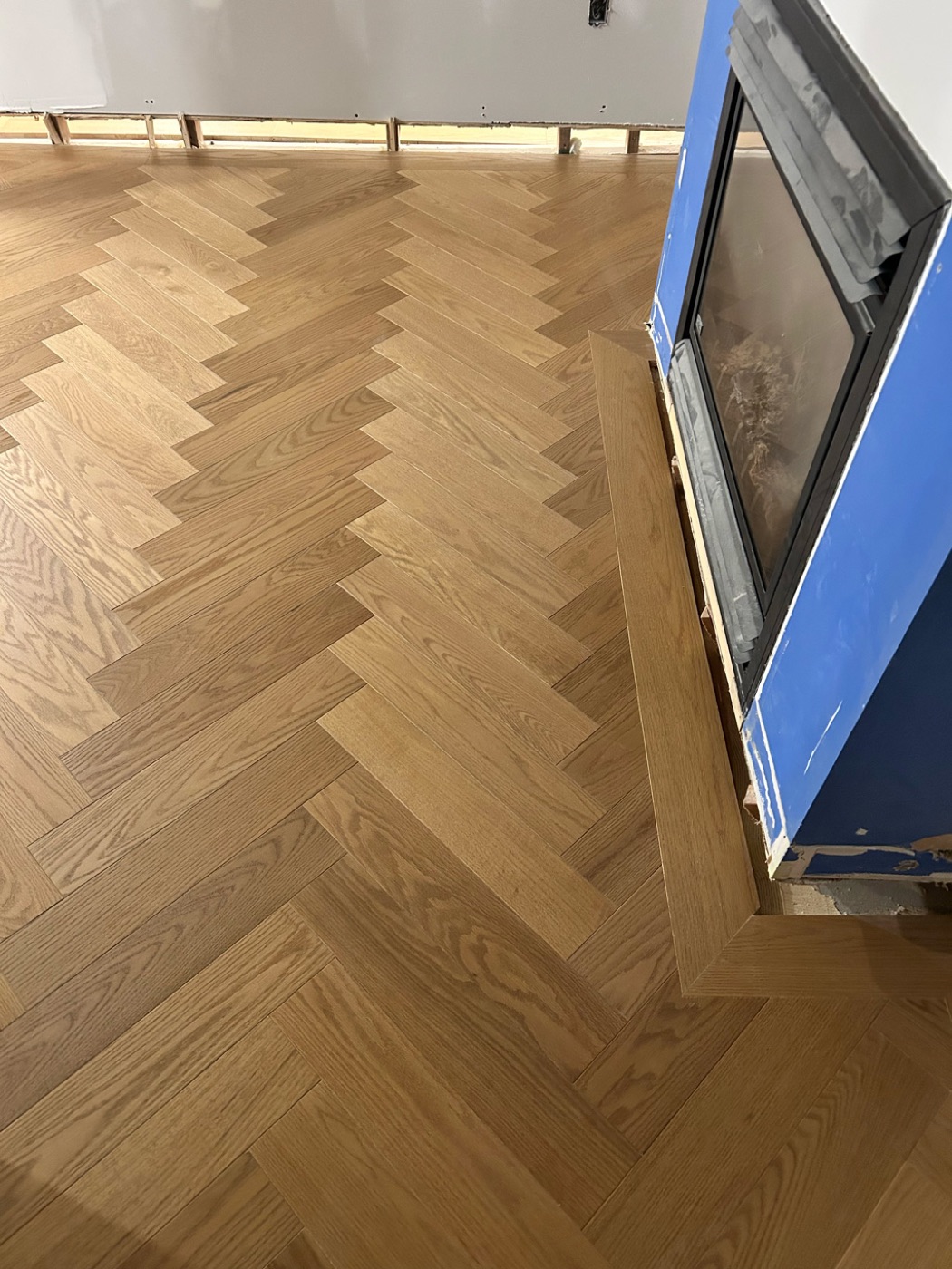 Custom herringbone hardwood flooring installation in an Ottawa home